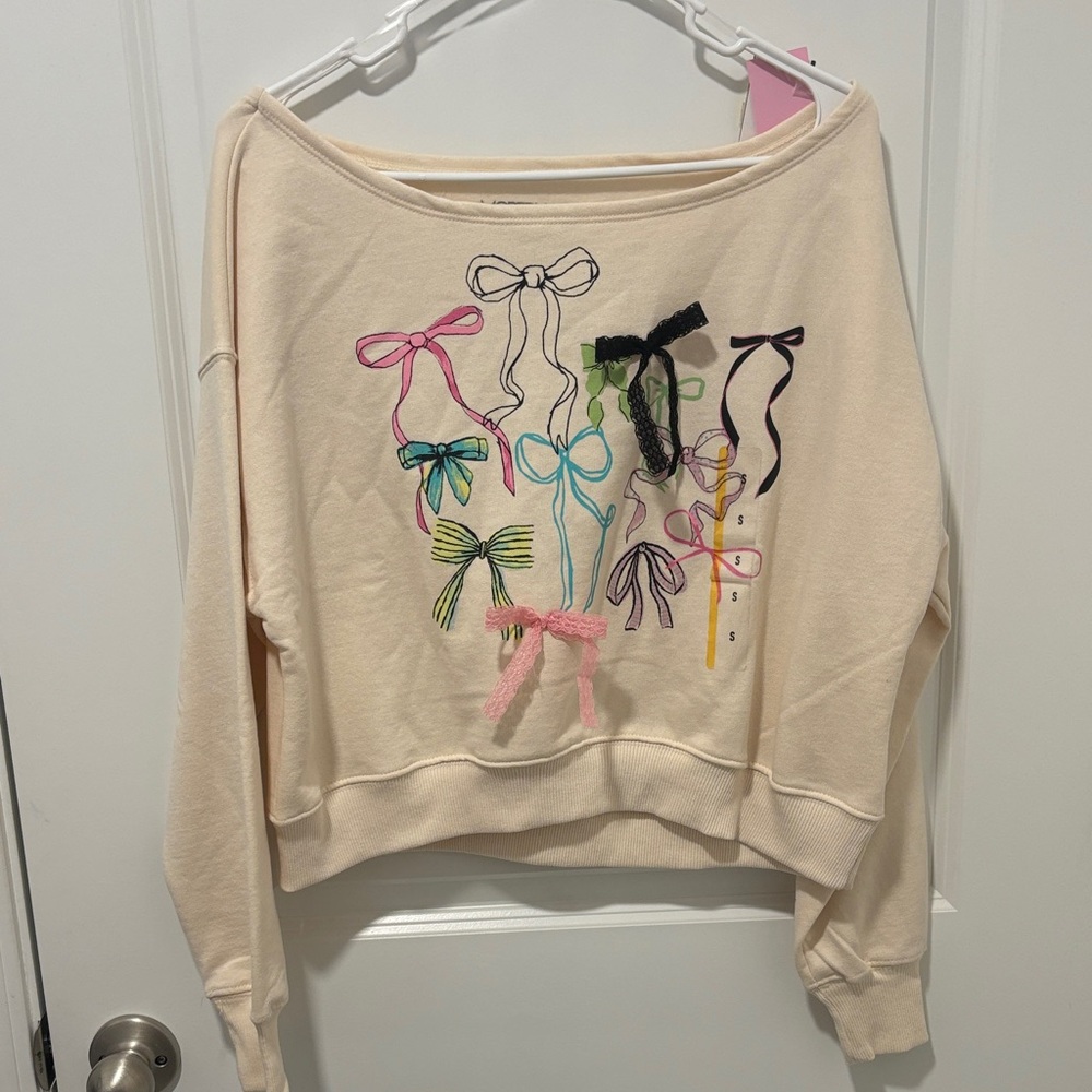 Modern Lux Cream Off-Shoulder Sweatshirt with Multicolor Bow Motif